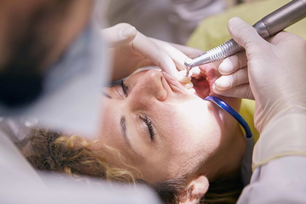 dentist using laser dentistry on patient